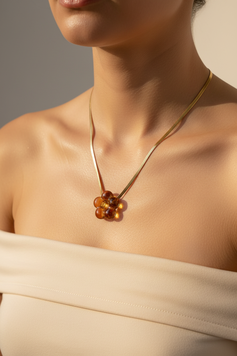 Bubble Flower Crystal Necklace — lifestyle shot on woman's neck with amber pendant